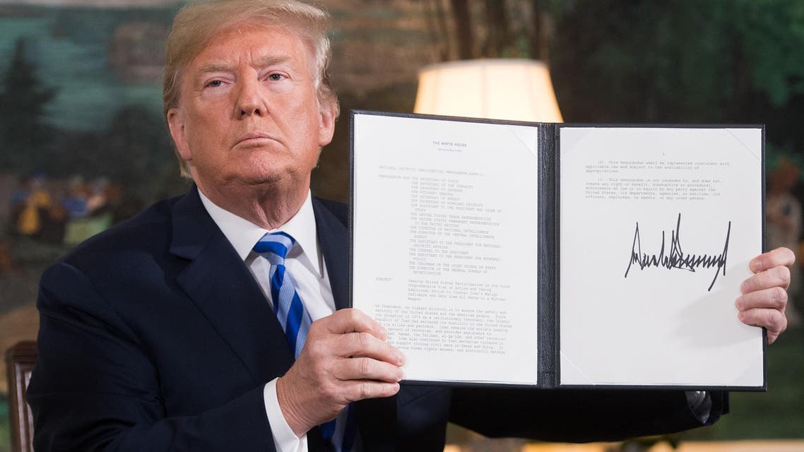 President Trump signs a document reinstating sanctions against Iran after announcing the US withdrawal from the Iran Nuclear deal at the White House on May 8, 2018. (AFP)