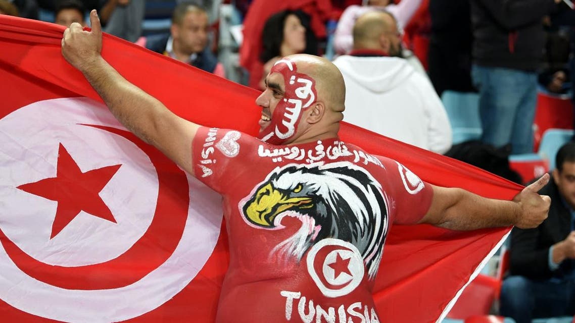 A Tunisian fan cheers for his national team ahead of the FIFA World Cup qualification football match between between Tunisia and Libya. (Reuters)
