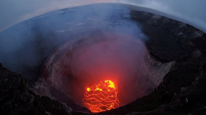 Kilauea volcano's summit lava lake shows a significant drop of roughly 220 metres below the crater rim in this wide angle camera view showing the entire north portion of the Overlook crater in Hawaii, US May 6, 2018. (Reuters)