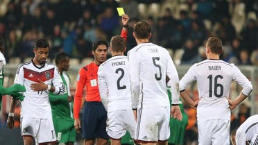 Referee Fahad Al Mirdasi of Saudi Arabia shows a yellow card to Germany's Grischa Proemel during the U20 soccer World Cup match. (AP)