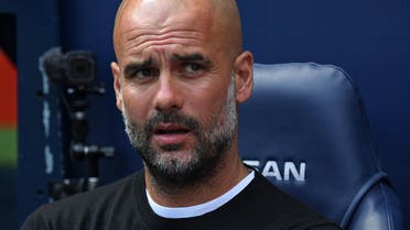 Manchester City's Spanish manager Pep Guardiola awaits kick off in the English Premier League football match between Manchester City and Huddersfield Town at the Etihad Stadium in Manchester, north west England, on May 6, 2018. Paul ELLIS / AFP