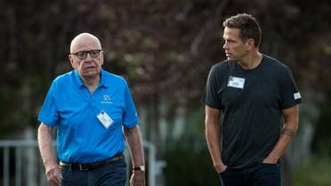 Rupert and Lachlan Murdoch walk together as they arrive on the third day of the annual Allen & Company Sun Valley Conference. (AFP)