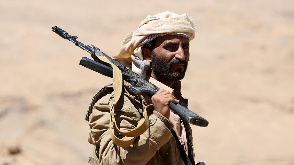 A pro-government government tribal fighter carries his weapon as he walks in Fardhat Nahm area. (File photo: Reuters)