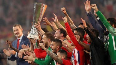 Atletico Madrid celebrate with the trophy after winning the Europa League. (Reuters)