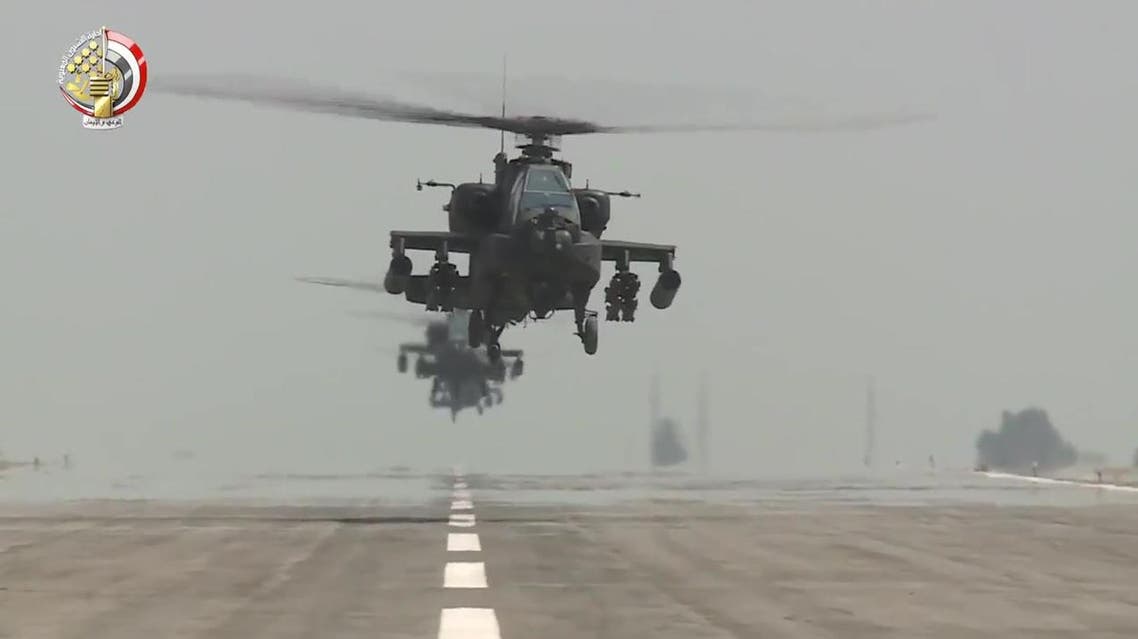 An image grab taken from a handout video released by the Egyptian Defence Ministry on November 25, 2017 shows US-made Egyptian army Apache attack helicopters flying from an airfield. (AFP)