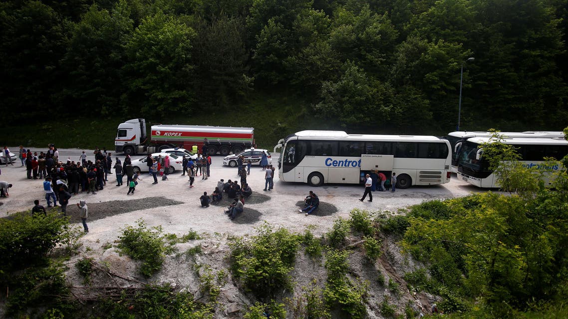 Buses with migrants that were stopped and turned back by the police stand on the road near Konjic, Bosnia and Herzegovina May 18, 2018. REUTERS/Dado Ruvic 