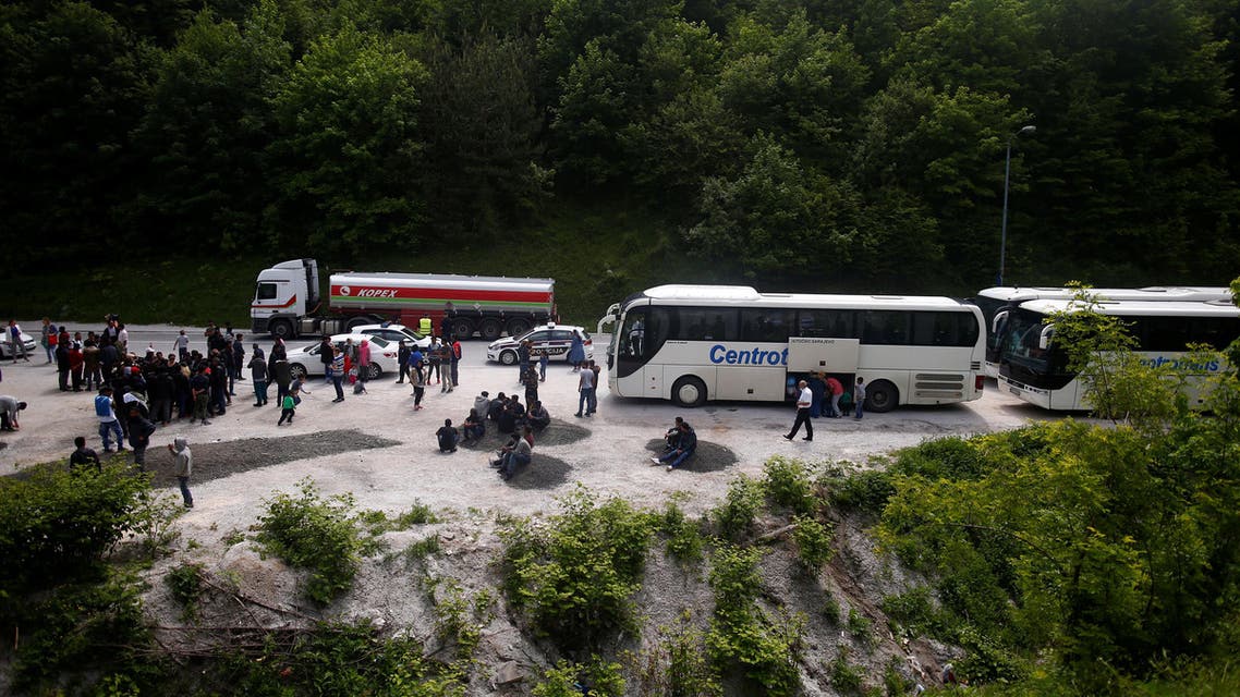 Buses with migrants that were stopped and turned back by the police stand on the road near Konjic, Bosnia and Herzegovina May 18, 2018. REUTERS/Dado Ruvic