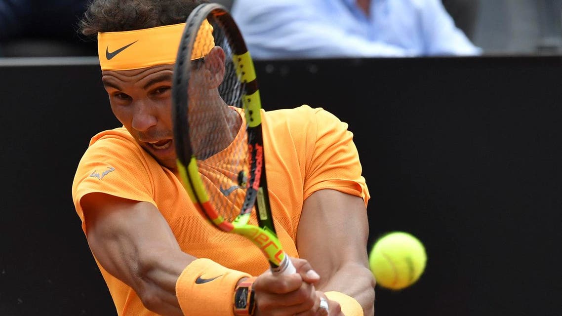 Spain’s Rafael Nadal hits a return to Italy's Fabio Fognini during Rome’s ATP Tennis Open tournament at the Foro Italico, on May 18, 2018 in Rome. (AFP)
