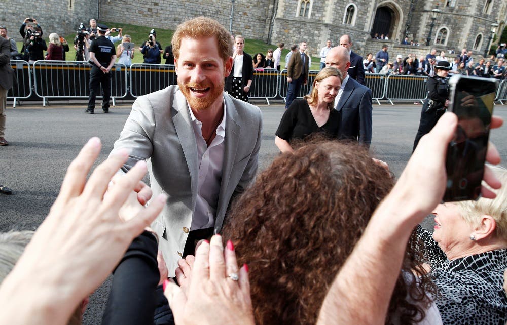 Britain's Prince Harry greets wellwishers outside Windsor Castle ahead of his wedding to Meghan Markle tomorrow, in Windsor, Britain, May 18, 2018. REUTERS/Damir Sagolj
