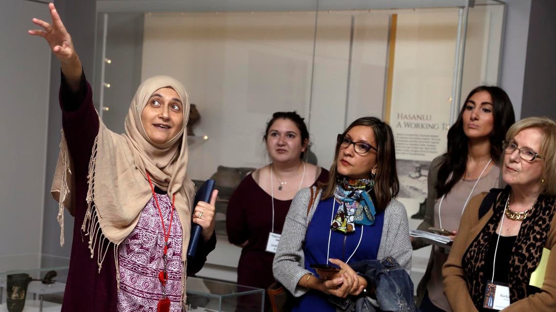 Moumena Saradar (left), originally from Syria, guides visitors through the Middle East gallery at Penn Museum, in Philadelphia. (AP)