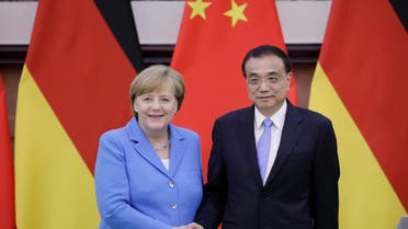 China's Premier Li Keqiang (R) shakes hands with German Chancellor Angela Merkel after a joint news conference at the Great Hall of the People in Beijing. (Reuters)