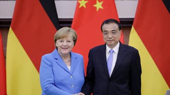 Merkel, Chinese premier defend Iran deal, free trade 