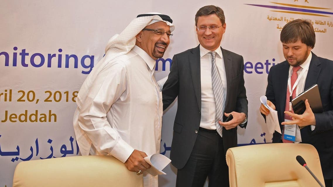 Saudi Energy Minister Khaled al-Faleh (L) and Russian Energy Minister Alexander Novak (C) attend a meeting of OPEC and non-OPEC members to assess compliance with production cuts and to discuss potential long-term cooperation, in Jeddah on April 20, 2018. (AFP)
