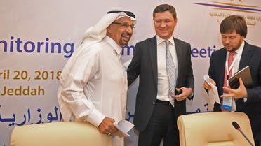 Saudi Energy Minister Khaled al-Faleh (L) and Russian Energy Minister Alexander Novak (C) attend a meeting of OPEC and non-OPEC members to assess compliance with production cuts and to discuss potential long-term cooperation, in Jeddah on April 20, 2018.  (AFP)