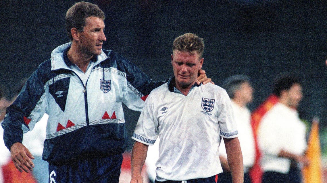 The July 4, 1990 file photo shows Gascoigne crying as he is escorted off the field by team captain Terry Butcher. (AP)
