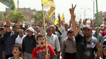 Syrian-Kurdish people demonstrate against demographic changes forced by Turkey to repopulate Kurdish areas, in Qamishli on May 26, 2018. Delil souleiman / AFP