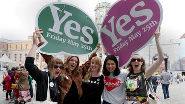 Yes campaigners jubilate as they wait for the official result of the Irish abortion referendum, at Dublin Castle in Dublin on May 26, 2018. The first official results declared in Ireland's historic referendum on its strict abortion laws, showed 60 percent in the Galway East constituency backed repealing the constitutional ban on terminations. (AFP)