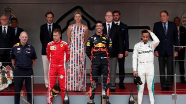 Red Bull’s Daniel Ricciardo celebrates winning the race with Ferrari’s Sebastian Vettel finishing second, Lewis Hamilton who finished in third while Prince Albert II of Monaco and Charlene, Princess of Monaco look on. (Reuters)