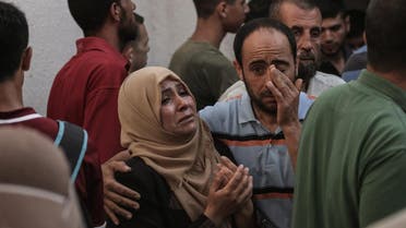 Palestinian relatives of Mohammed al-Radeia, 30, mourn during to his funeral in Beit Lahia in the northern Gaza Strip on May 28, 2018. The Palestinian mna was killed by Israeli tank fire into northern Gaza today, the health ministry in the Hamas-run enclave said. An Israeli army spokeswoman told AFP that two Palestinian men tried to breach the border fence "with the intention of carrying out an attack".