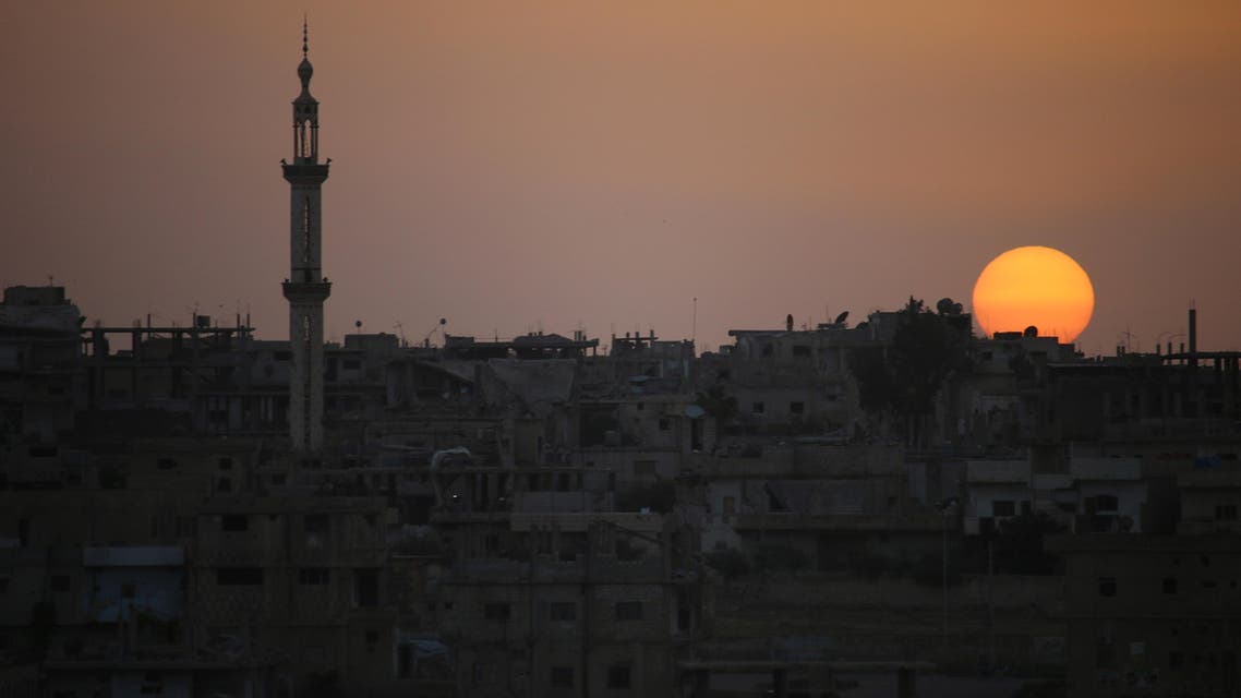 A general view shows the sun setting over a rebel-held area in the southern Syrian city of Daraa on April 20, 2018. After the capture of Eastern Ghouta the Syrian president now has forces ready to redeploy elsewhere in the war-ravaged country. The Islamists and jihadists that hold the northwest province of Idlib remain a threat, but analysts say the Syrian president's priority will likely be the southern province of Daraa, where protests against his rule first broke out in 2011. Mohamad ABAZEED / AFP