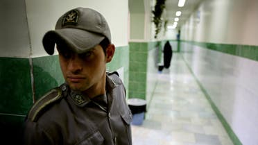A prison guard stands along a corridor in Tehran’s Evin prison June 13, 2006. (Reuters)