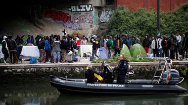 A makeshift camp is cleared away after French police evacuated hundreds of migrants living in tents along a canal in Paris, France, May 30, 2018. REUTERS/Benoit Tessier