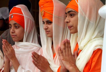 Sikh girls attend a religious festival to celebrate the 549th birth anniversary of their spiritual leader Baba Guru Nanak, at Nankana Sahib near Lahore, Pakistan, on Nov. 4, 2017. (AP)