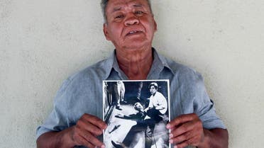 Juan Romero, 67, holds a photo of himself and the dying Sen. Robert F. Kennedy at the Ambassador Hotel in Los Angeles, taken by the Los Angeles Times’ Boris Yaro on June 5, 1968. (AP)