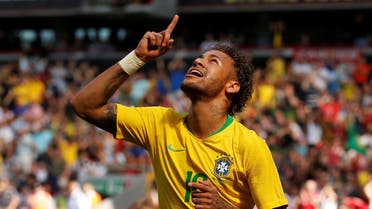 Brazil's Neymar celebrates scoring their first goal. (Reuters)