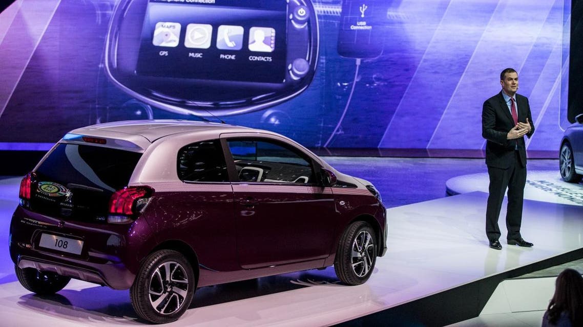 Peugeot Brand CEO at PSA Peugeot Citroen Maxime Picat presents the Peugeot's 108 at the group's stand of the Geneva Motor Show. (File photo: AFP)