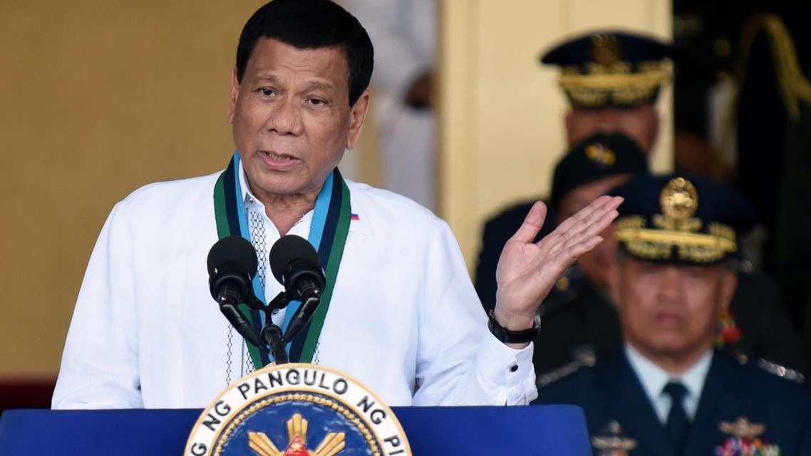 Social media was abuzz with photos and videos of Duterte on stage asking an unidentified woman from an audience of Filipinos to kiss him in exchange for a book he was handing out. (Reuters)