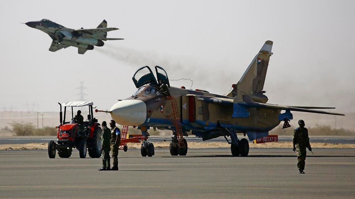 Members of the Sudanese air force prepare a plane during a joint drill at the Marwa air base, near Meroe some 350 kilometres north of Khartoum. (AFP)