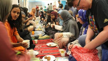 Ladies sitting down to the ‘Green Iftar’ eating from crockery and cutlery brought from home to prevent plastic waste. (Supplied)