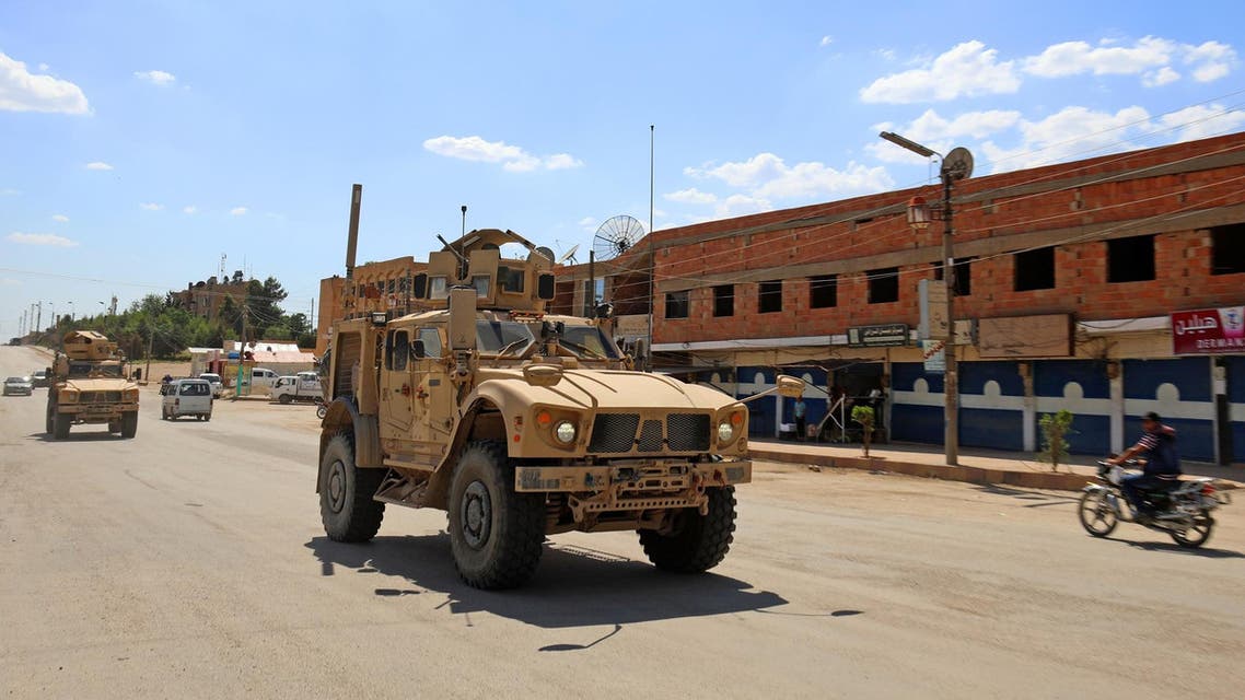 Vehicles of the US-led coalition battling ISIS patrol the town of Rmelane in Syria’s Hasakeh province on June 5, 2018. (AFP)