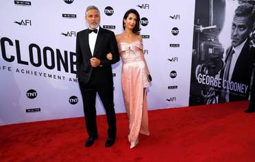 Actor Clooney and his wife Amal pose at the 46th AFI Life Achievement Award Gala in Los Angeles. (Reuters)