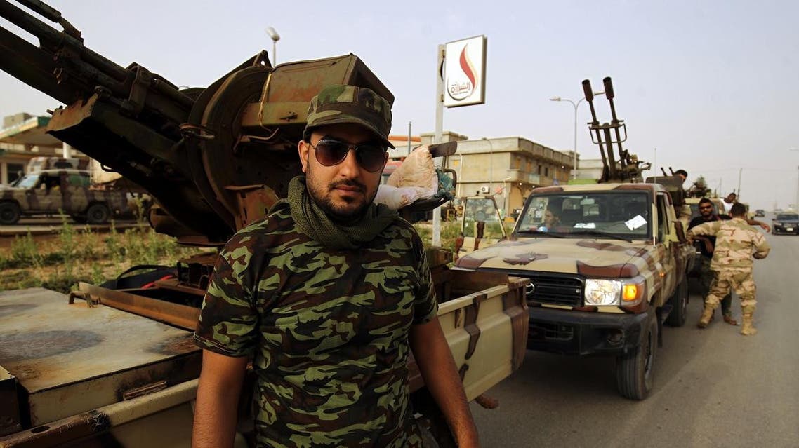 A Libyan fighter, loyal to Libyan strongman Khalifa Haftar, gathers near the coastal city of Derna. (AFP)