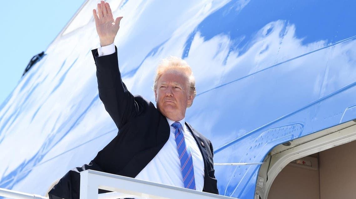 US President Donald Trump boards Air Force One prior to departure from Canadian Forces Base Bagotville, on way to Singapore to meet with North Korean leader Kim Jong Un on June 12. (AFP)