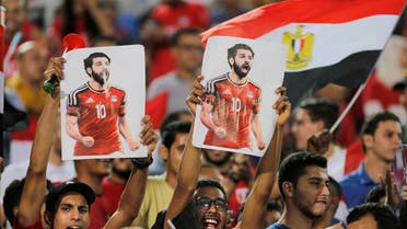 Fans hold poster of Egyptian national soccer team player and Liverpool's star striker Mohammed Salah during Egypt's final practice for the World Cup. (AP)