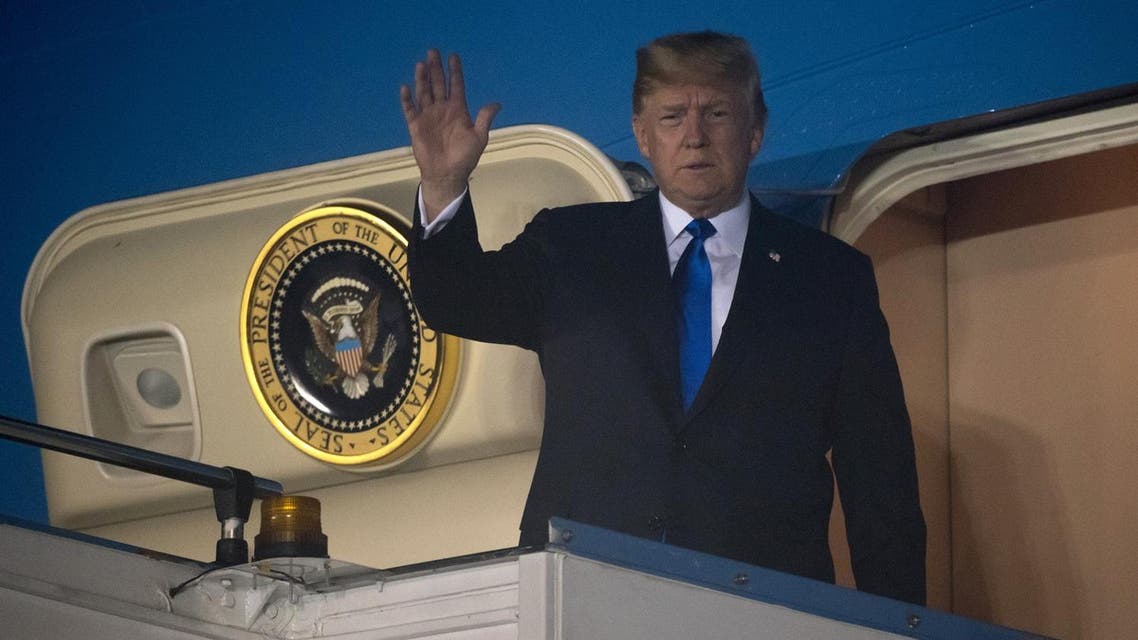 US President Donald Trump waves after Air Force One arrived at Paya Lebar Air Base in Singapore on June 10, 2018, ahead of his planned meeting with North Korea's leader Kim Jong Un. (AFP)
