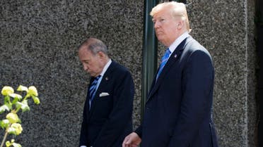 US President Donald Trump, with Director of the National Economic Council National Larry Kudlow (L), leaves the G7 summit in La Malbaie, Quebec. (AFP)