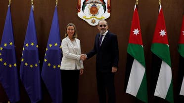 Jordanian Foreign Minister Ayman Safadi shakes hands with EU High Representative for Foreign Affairs Federica Mogherini in Amman. (Reuters)