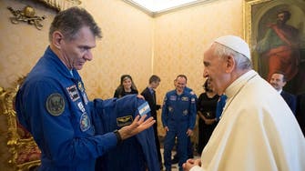Astronauts give Pope Francis personalized space suit, add white cape