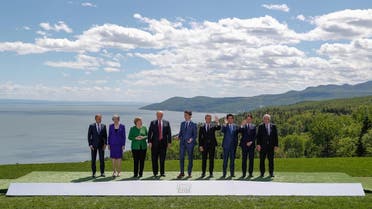 G7 leaders pose for a group photo at the G7 Summit in the Charlevoix city of La Malbaie. (Reuters)