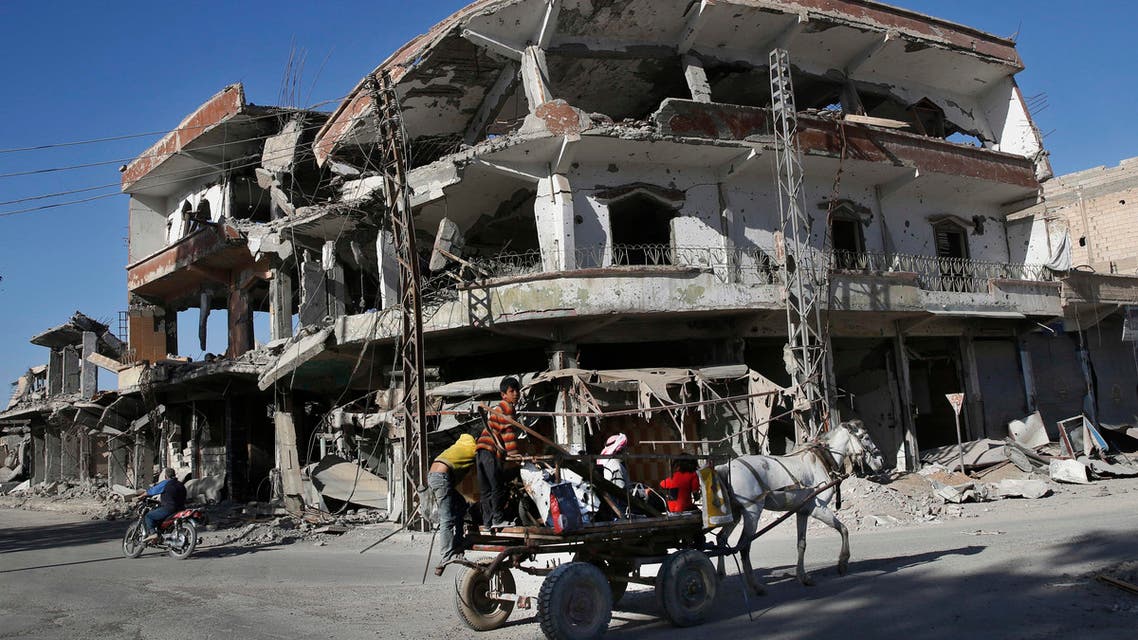 The remains of buildings line a street damaged during fighting between US-backed SDF and ISIS militants, in Raqqa, on April 5, 2018. (AP)