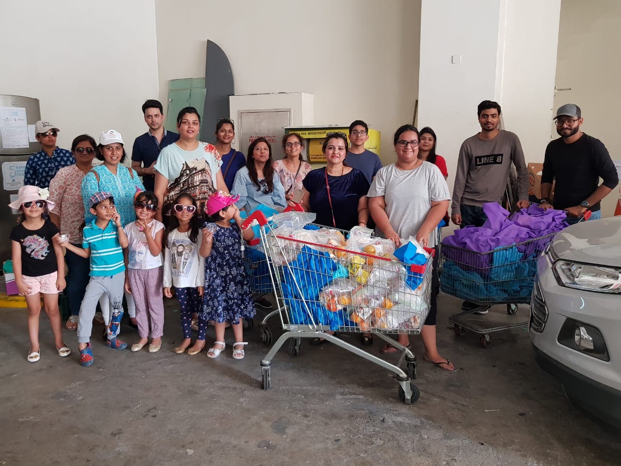 Swathi Santhosh (centre) with her Ramadan Sharing Fridges team in Dubai. The team distributed over 450 food packets to the workers everyday and plans to distribute 1000 phone calling cards to nearby labour camps for Eid. (Supplied)
