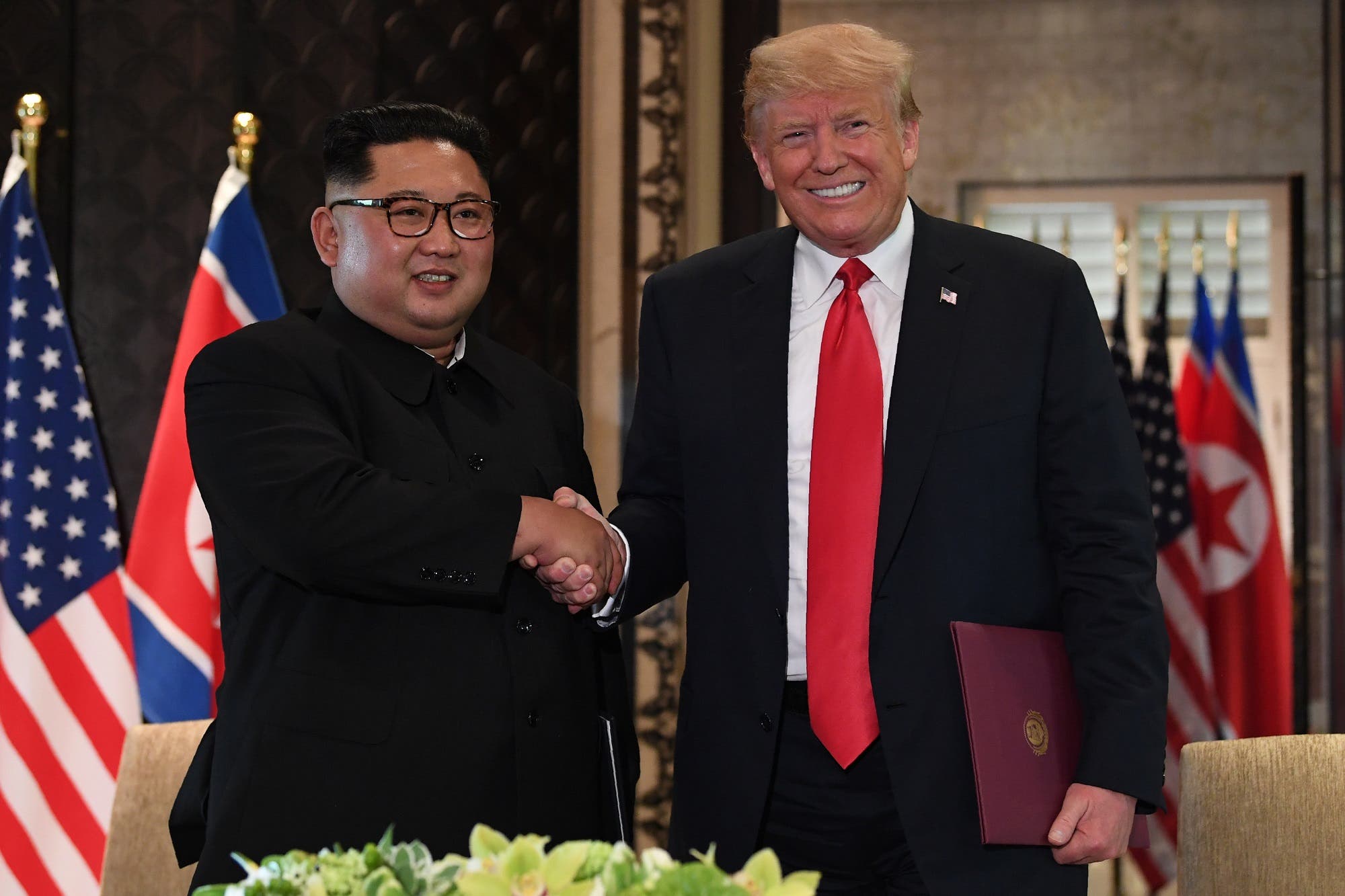 President Trump and Kim Jong Un shake hands following the signing ceremony in Singapore on June 12, 2018. (AFP)