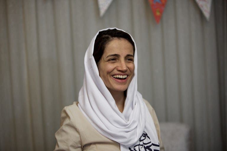 Iranian lawyer Nasrin Sotoudeh smiles at her home in Tehran on September 18, 2013, after being freed following three years in prison. (AFP)