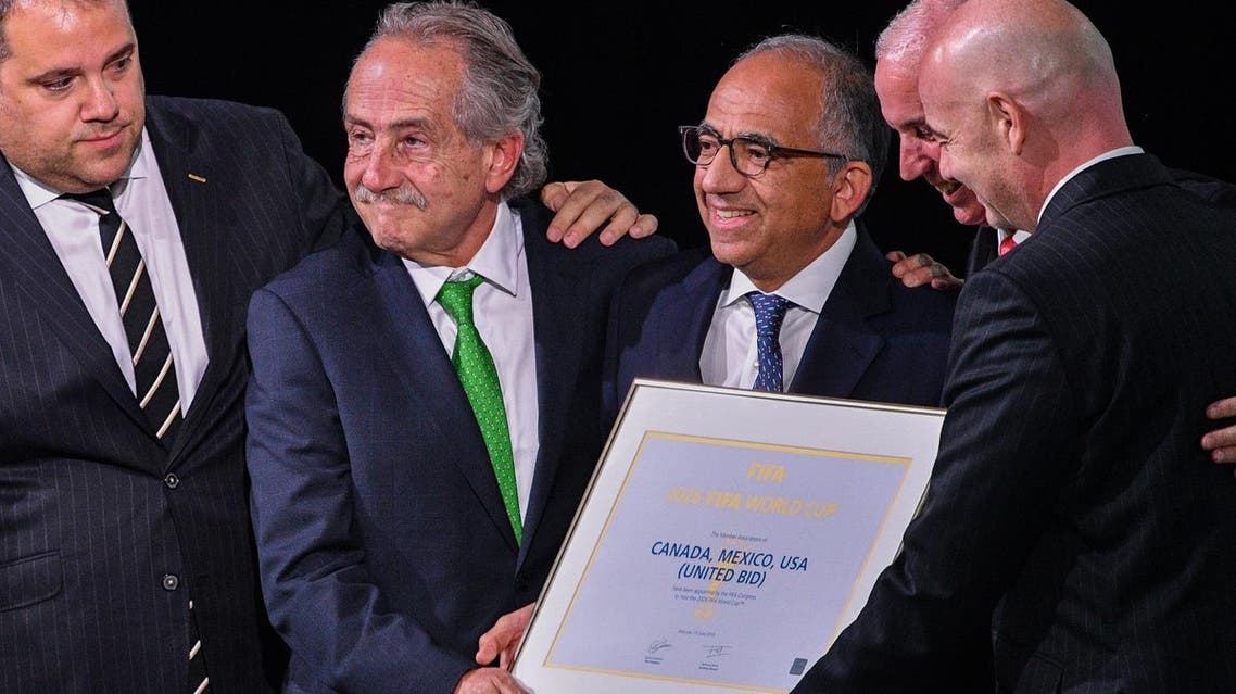 FIFA president Gianni Infantino (R) poses with the United 2026 bid (Canada-Mexico-US) officials in Moscow on June 13, 2018. (AFP)