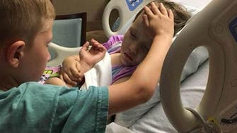 Photo of 6-year-old boy comforting younger sister dying of cancer goes viral