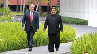 Trump walks with North Korean leader Kim Jong Un at the Capella Hotel on Sentosa island in Singapore. (Reuters)